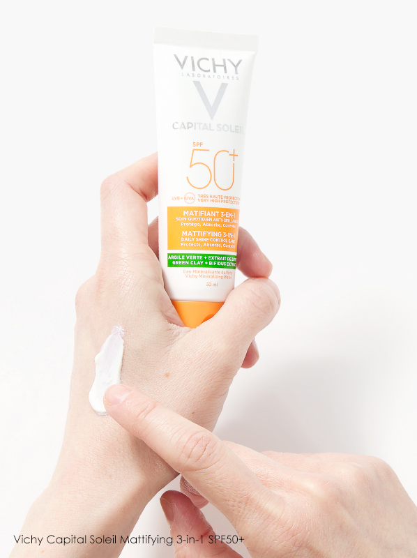  Image of Vichy Capital Soleil Mattifying 3-in-1 SPF50 held in hands with texture shown