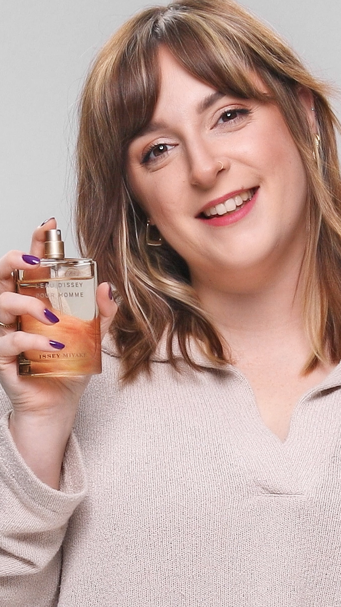 Corinne holding Vetiver Intense for review