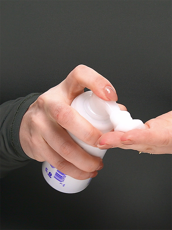 Image of Caudalie Vinoperfect Brightening Micropeel Foam being pumped into a hand